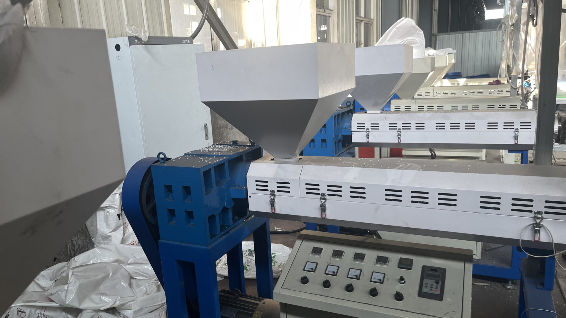 Plastic profile extrusion production line